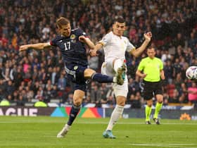 GLASGOW, SCOTLAND - JUNE 08: Stuart Armstrong of Scotland shoots as Eduard Spertsyan of Armenia tries to block during the UEFA Nations League League B Group 1 match between Scotland and Armenia at Hampden Park National Stadium on June 08, 2022 in Glasgow, Scotland. (Photo by Ian MacNicol/Getty Images)