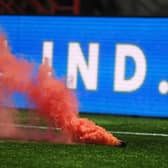 A smoke bomb is thrown onto the pitch during a Scottish Cup match between Hamilton Accies and Hearts at the ZLX Stadium.