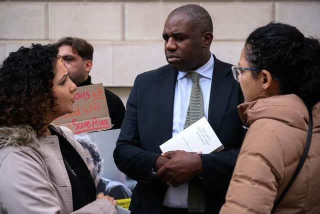 Shadow Home Secretary David Lammy stands with Mona and Sanaa Seif, as they hold a protest calling for the release of their brother Alaa Abd el-Fattah at the Foreign & Commonwealth Office in London. The Egyptian/British writer, blogger and pro-democracy activist has spent eight out of the last ten years in jail on a range of charges, including spreading false news and terrorism. He was an icon of the 2011 Arab Spring demonstrations and jailed in 2019 and has been on hunger strike.