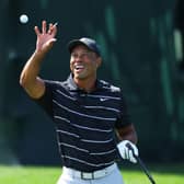 Tiger Woods catches a ball on the practice area after arriving to start his final preparatins for The Masters at Augusta National Golf Club. Picture: Andrew Redington/Getty Images.