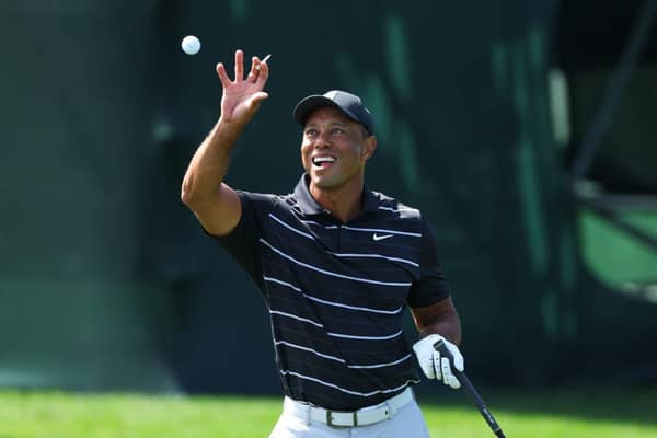 Tiger Woods catches a ball on the practice area after arriving to start his final preparatins for The Masters at Augusta National Golf Club. Picture: Andrew Redington/Getty Images.