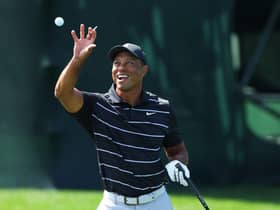 Tiger Woods catches a ball on the practice area after arriving to start his final preparatins for The Masters at Augusta National Golf Club. Picture: Andrew Redington/Getty Images.