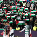 Celtic fans hold up Palestine flags during the weekend match against Hearts at Tynecastle. (Photo by Craig Foy / SNS Group)