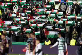 Celtic fans hold up Palestine flags during the weekend match against Hearts at Tynecastle. (Photo by Craig Foy / SNS Group)
