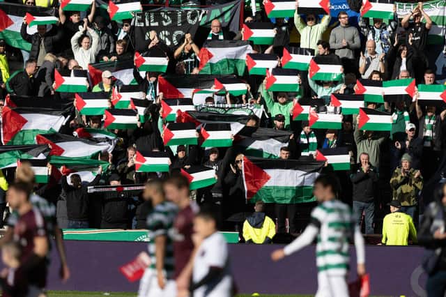 Celtic fans hold up Palestine flags during the weekend match against Hearts at Tynecastle. (Photo by Craig Foy / SNS Group)