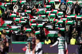Celtic fans hold up Palestine flags during the weekend match against Hearts at Tynecastle. (Photo by Craig Foy / SNS Group)