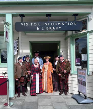 Group of Jacobite storytellers outside the VisitScotland iCentre in Ballater.