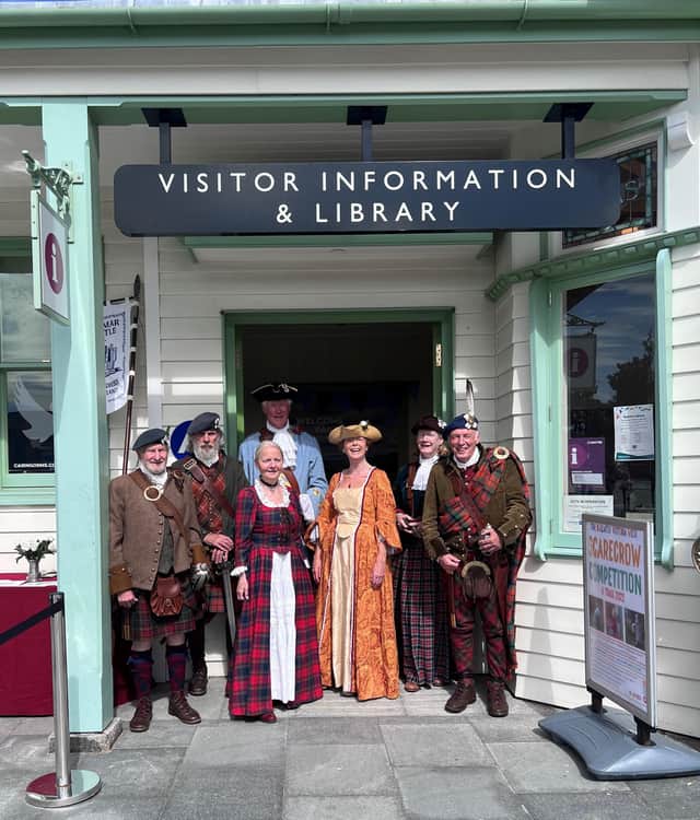 Group of Jacobite storytellers outside the VisitScotland iCentre in Ballater.