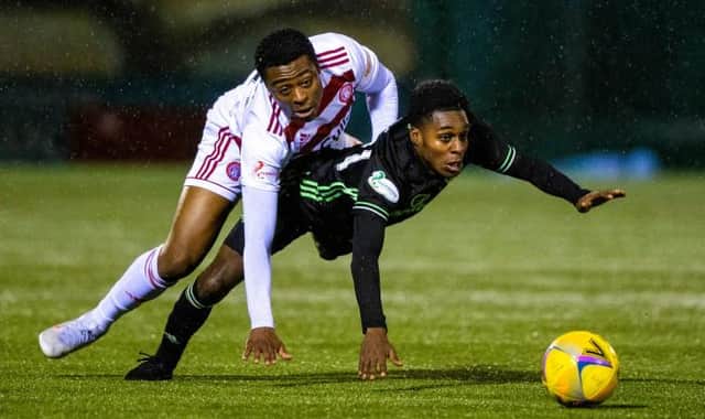 Tunde Owolabi and Jeremie Frimpong during the Scottish Premiership match between Hamilton and Celtic at the FOYS Stadium on December 26, 2020, in Hamilton, Scotland. (Photo by Craig Williamson / SNS Group)