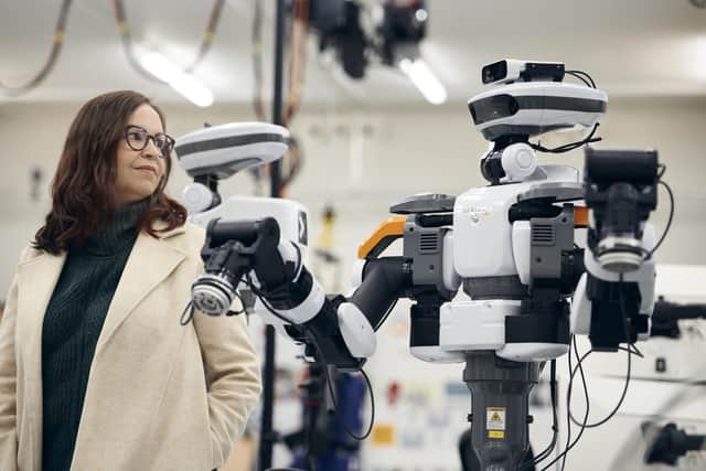 Professor of AI and ethics Shannon Vallor meets a robot at the Bayes Centre.