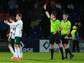 Hibs' Martin Boyle is shown a red card by referee Gavin Duncan after the final whistle following the 1-0 defeat to Ross County in Dingwall. (Photo by Ross MacDonald / SNS Group)