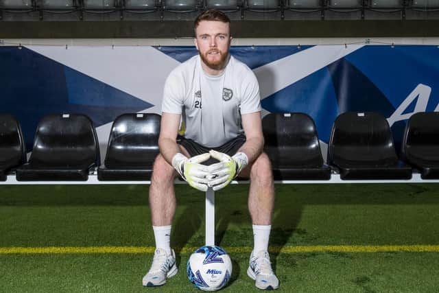 Hearts goalkeeper Zander Clark has been called into the Scotland squad.