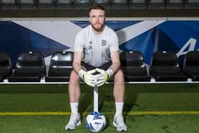 Hearts goalkeeper Zander Clark has been called into the Scotland squad.