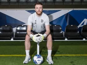 Hearts goalkeeper Zander Clark has been called into the Scotland squad.