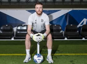 Hearts goalkeeper Zander Clark has been called into the Scotland squad.
