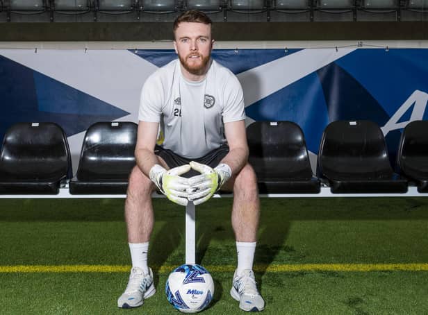 Hearts goalkeeper Zander Clark has been called into the Scotland squad.