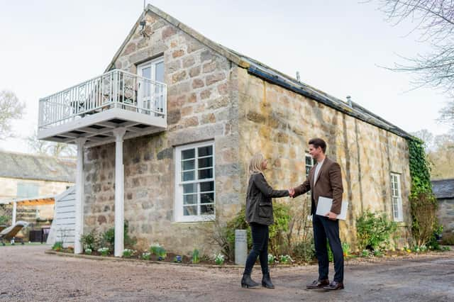 Heritage Hosting managing director, Simon Hudson, with the owner of The Ranch House Cottage (Pic:Jonathan Addie)