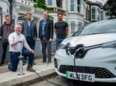 CEO Ian Mackenzie (kneeling) and team members demonstrating one of the firm's flat-and-flush EV charging points. Picture: Darren Cool.