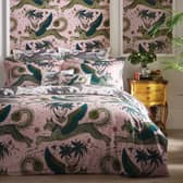 A Lynx Blush Duvet, bolstered by matching hangings