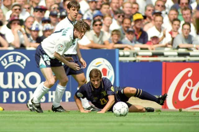 Tosh McKinlay in action for Scotland against Steve McManaman of England at Wembley during Euro 96