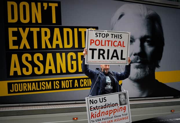 A demonstrator protests outside of the Old Bailey court in London as a request to extradite WikiLeaks founder Julian Assange by the US authorities is considered (Picture: Tolga Akmen/AFP via Getty Images)