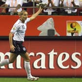 Kelly Smith celebrates scoring during the 2007 FIFA Women's World Cup (Photo credit should read MARCUS BRANDT/AFP via Getty Images)