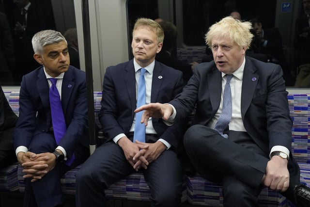 (Right to left) Prime Minister Boris Johnson with Transport Secretary Grant Shapps and Mayor of London Sadiq Khan on a Elizabeth Line train at Paddington station in London, to mark the completion of London's Crossrail project.