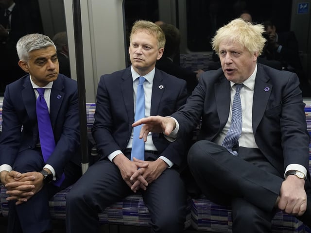 (Right to left) Prime Minister Boris Johnson with Transport Secretary Grant Shapps and Mayor of London Sadiq Khan on a Elizabeth Line train at Paddington station in London, to mark the completion of London's Crossrail project.