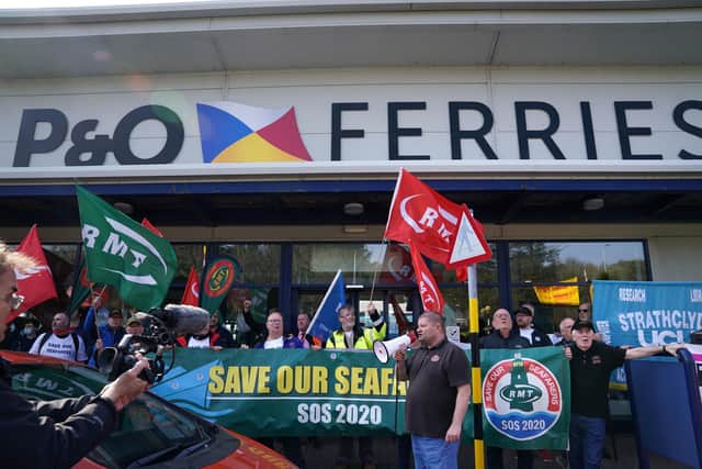 People take part in a demonstration against the dismissal of P&O workers organised by the Rail, Maritime and Transport (RMT) union at the P&O ferry terminal in Cairnryan. Picture: Andrew Milligan/PA Wire