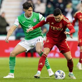Aberdeen's Jamie McGrath tussles with Hibs' Joe Newell during the match at Easter Road.