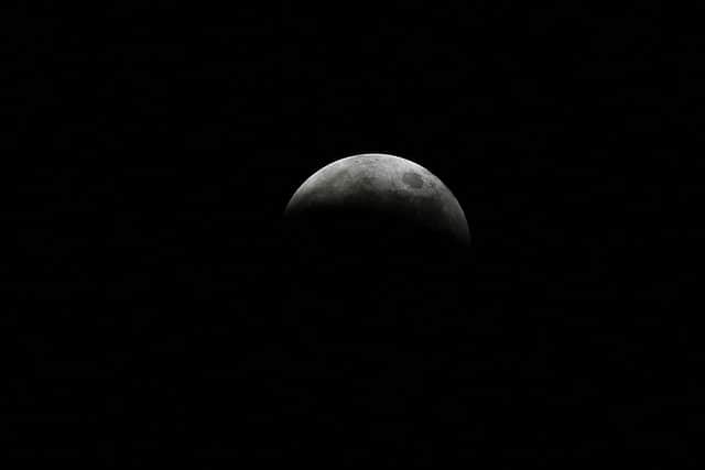 The moon, pictured here during a lunar eclipse, takes on eight different appearances during a lunar cycle, including that of a new moon. (Pic: Getty)