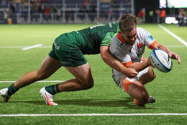 Edinburgh's Adam McBurnie scores a first half try during a pre-season friendly against Connacht.
