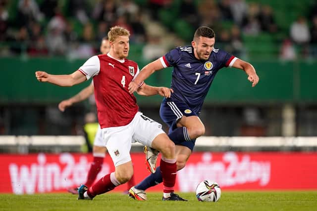John McGinn battles for possession with Martin Hinteregger during Scotland's friendly international against Austria in Vienna. (Photo by Christian Hofer/Getty Images)