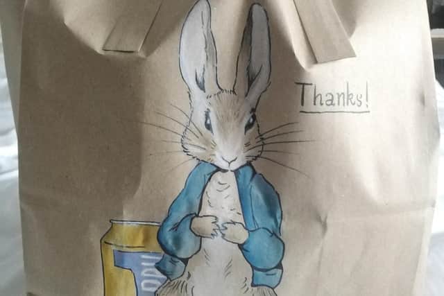 Peter Rabbit drawn next to a can of Irn Bru - Tristan's drawings had a Scottish theme to them.