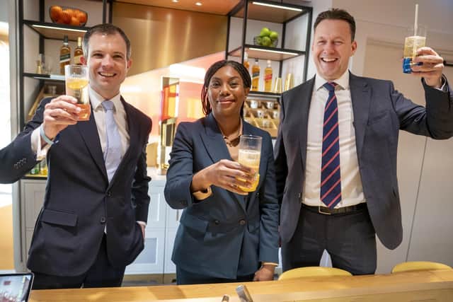 Shadow Scottish Secretary Andrew Bowie, UK Conservative leader Kemi Badenoch and Scottish Conservative leader Russell Findlay raise a glass.
