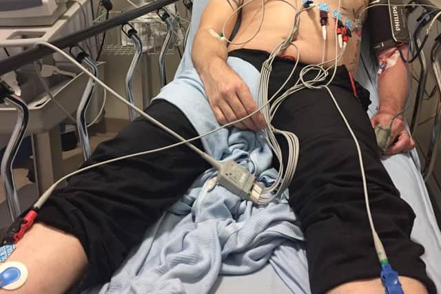 Andy Dobinson in his hospital bed shortly after his stroke.