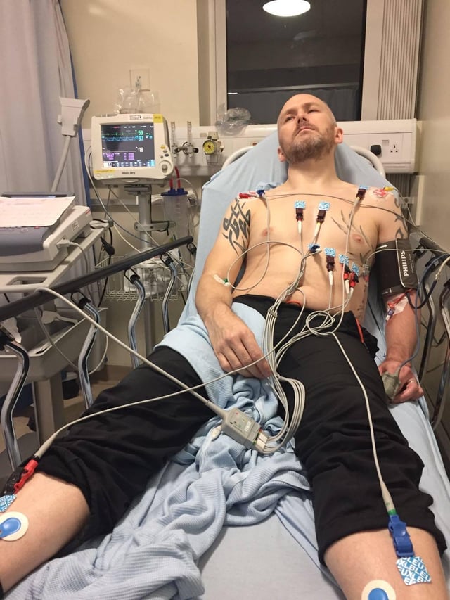 Andy Dobinson in his hospital bed shortly after his stroke.