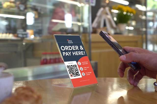Customers scan a QR code at their table with their phone. Picture: contributed.