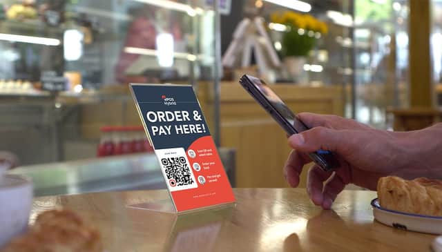 Customers scan a QR code at their table with their phone. Picture: contributed.