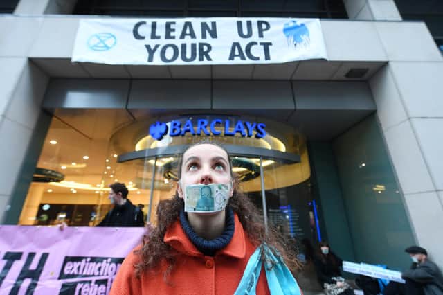 A previous event by climate change protesters demonstrating outside a branch of Barclay's bank in Glasgow