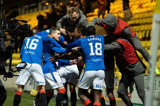 Alfredo Morelos is mobbed by his team-mates after scoring Rangers' late winner against Livingston. (Photo by Alan Harvey / SNS Group)