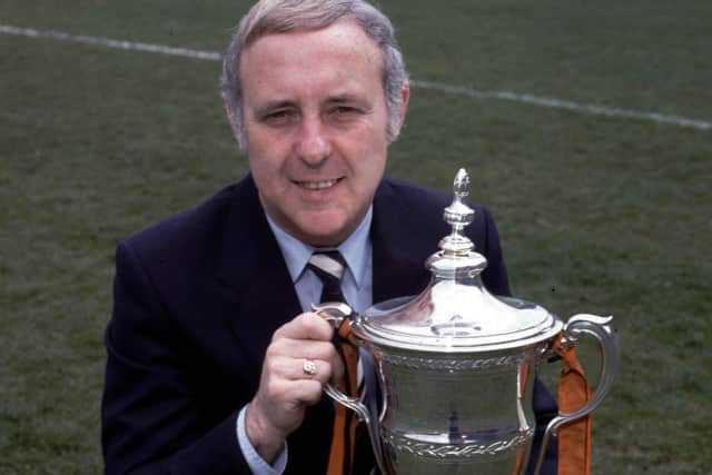 Dundee United manager Jim McLean sits proudly with the Premier Division trophy which United won in season 1982/83.