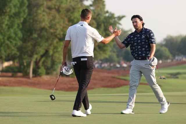 Nicolai Hojgaard and Ewen Ferguson shake hands on the 18th green after playing together in the final round of the DP World Tour season. Picture: Luke Walker/Getty Images.