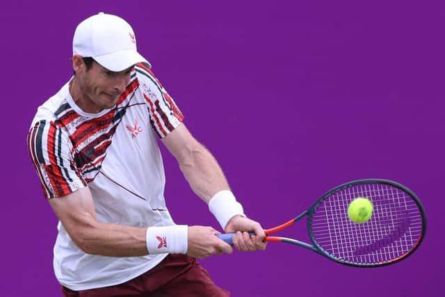 Andy Murray returns against Italy's Matteo Berrettini during their second round match at Queen's Club.