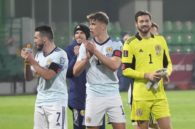 Scotland's players applaud fans at the end of the World Cup 2022, group F, qualifying soccer match between Moldova and Scotland, at the Zimbru stadium in Chisinau, Moldova, Friday, Nov. 12, 2021. (AP Photo/Sergei Grits)