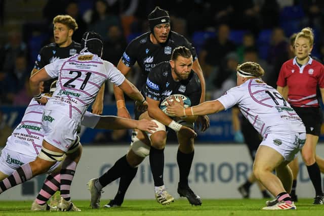 Glasgow Warriors' Ryan Wilson is tackled during a pre-season friendly match against Ayrshire Bulls at the Caldonian Stadium.