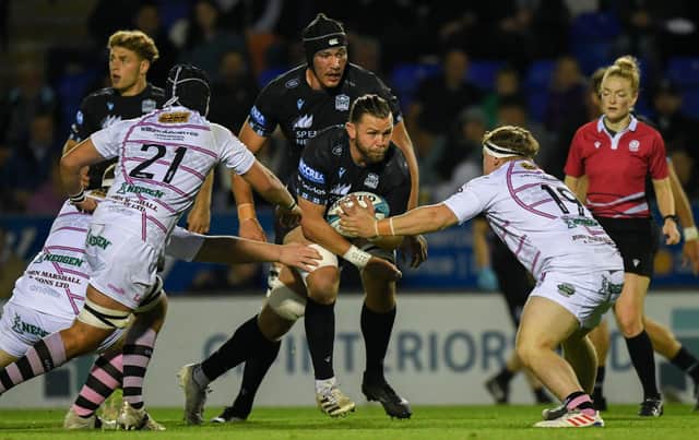 Glasgow Warriors' Ryan Wilson is tackled during a pre-season friendly match against Ayrshire Bulls at the Caldonian Stadium.