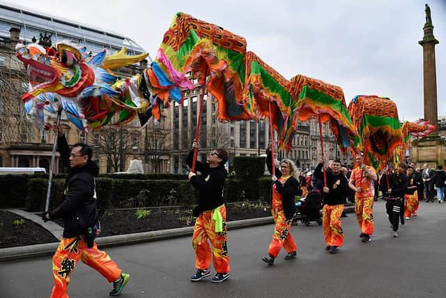 The Chinese community in Glasgow, seen celebrating Chinese New Year in 2017, will soon mark the Year of the Tiger (Photo by Jeff J Mitchell/Getty Images)