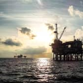 An offshore oil platform at sunset