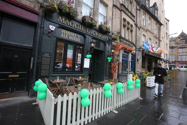 Even the pubs that are open, like this one in Edinburgh, decked out for St Patrick's Day, were unusually quiet (Picture: Andrew Milligan/PA Wire)